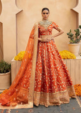 Aabroo latest trending luxury mehndi & formal lehenga in Rest Orange with floral embroidery, sequins, pearls, dabka, naqshi, and crystals by Waqas Shah Lahore Pakistan