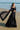 Black Musk black lehenga choli with the sheer net dupatta flowing in the wind, Pakistani luxury formal wear