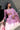 Crystal Blush blush pink formal lehenga choli with net dupatta, styled with a potli on the staircase