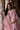 Diyar blush pink bridal lehenga with the embroidered net dupatta draped over the shoulders by Waqas Shah Official
