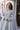 Jhoomar misty blue bridal maxi showing the embellished bodice with cutout neckline by Waqas Shah Official
