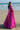 Back view of the Lyric magenta pink formal lehenga with the embellished net dupatta draped behind