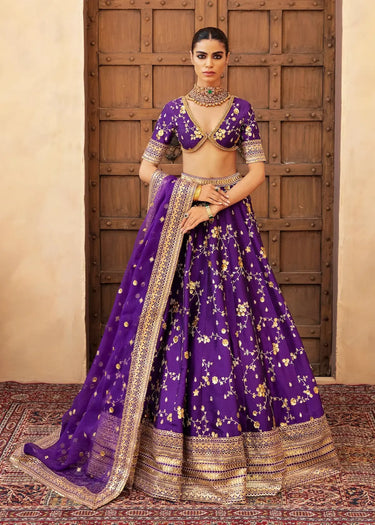 Mahrang latest trending luxury mehndi & formal lehenga in Purple with tear drop hand embellished mirror work, pearls, dabka, and crystals by Waqas Shah Lahore Pakistan
