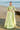 Mint Bloom mint green lehenga choli standing by a wooden boat, a Pakistani formal look for wedding guests
