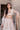 Full-length Mystic Rose white nikkah lehenga choli worn with the sheer embellished net dupatta