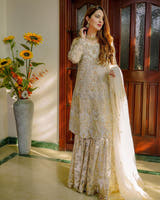 OMAIRAH Off White Badla Sharara with Mukesh work Net dupatta and four sided Kiran border by Waqas Shah Official