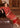 Red formal dress with intricate beige and golden threadwork by Waqas Shah Official