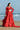 Detail of the Ruby red flared lehenga showing the all-over sequin and thread embroidery