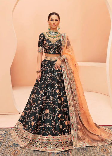 Shah Bano latest trending luxury mehndi & formal lehenga in Dark Green with mirror work, pearls, zardozi, and tone-on-tone embroidery by Waqas Shah Lahore Pakistan