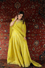 Neon Yellow Raw Silk Mehndi lehenga with handcrafted embroidery and mirror work by Waqas Shah Official