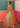 Peach reception dress featuring an open front Net gown and embellished lehenga by Waqas Shah Official