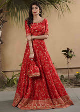 Red Raw Silk Bridal Lehenga with Lotus motifs all-over Jaal stones and beads by Waqas Shah Official