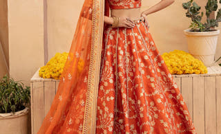 Aabroo rust orange Pakistani mehndi bridal lehenga choli by Waqas Shah