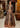 Open-front Pakistani pishwas worn over a lehenga: Fakhar un Nisa in black raw silk by Waqas Shah, comparing pishwas and lehenga silhouettes