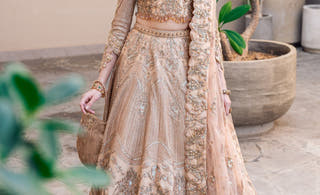 Golden Patel golden bridal lehenga choli by Waqas Shah