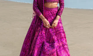 Lyric magenta Pakistani bridal reception lehenga choli, a walima and reception look by Waqas Shah