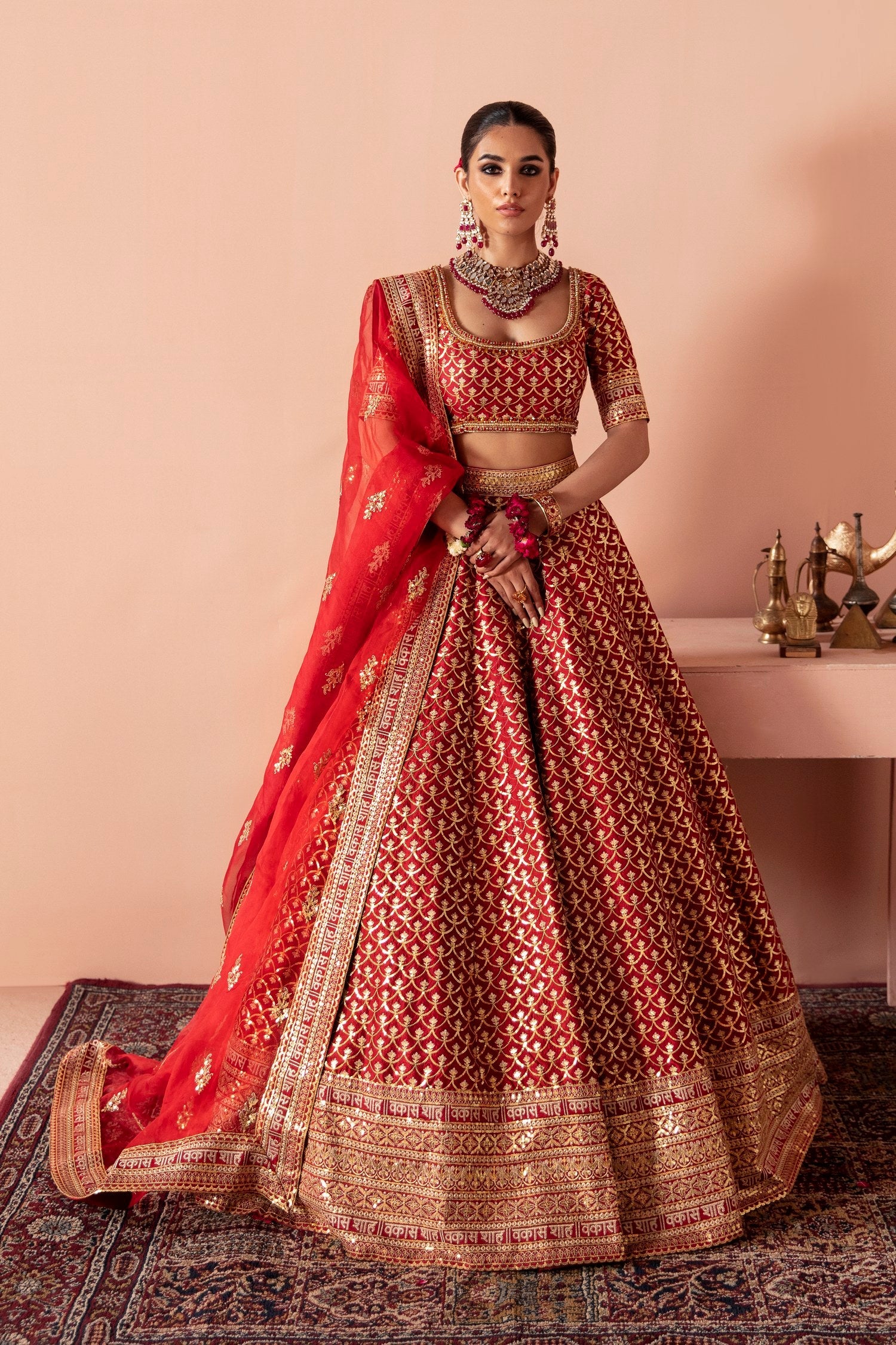 Mastani red Pakistani mehndi and barat lehenga choli by Waqas Shah