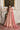 Primrose tea pink sequin lehenga choli by Waqas Shah, full front view beside a marble fireplace