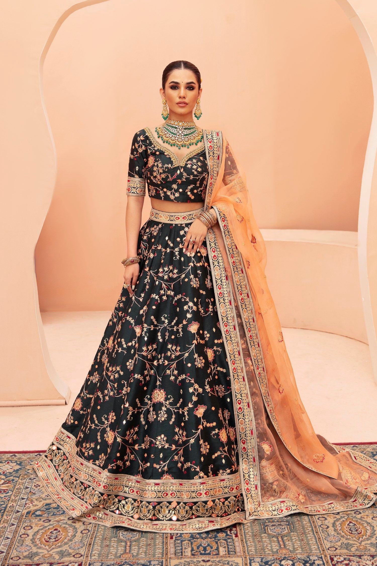 Shah Bano dark green mirror work mehndi lehenga choli with peach dupatta by Waqas Shah