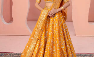 Zari mustard yellow Pakistani mehndi lehenga choli by Waqas Shah