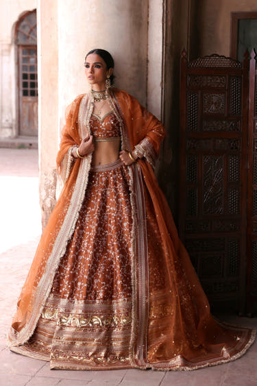 Gurleen rust brown bridal lehenga choli, full front view with organza dupatta draped over both shoulders