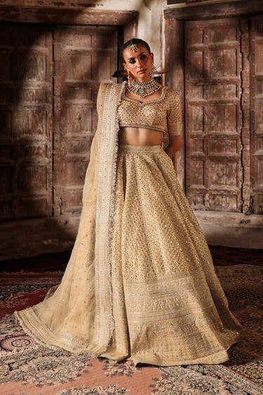 Saanvi skin gold raw silk lehenga choli, full front view with organza dupatta, by Waqas Shah