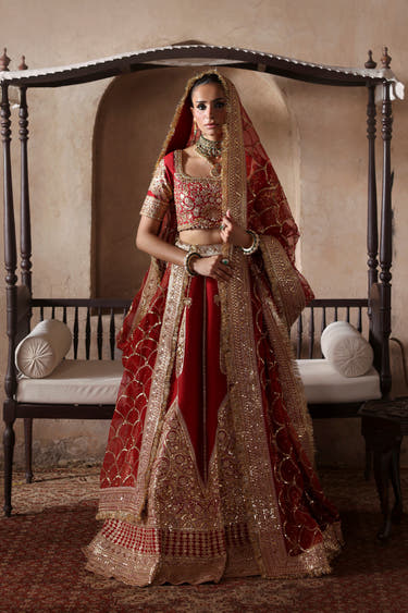 Simran red Pakistani bridal lehenga choli by Waqas Shah, full front view with organza dupatta over the head