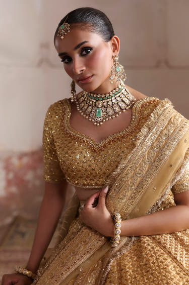 Saanvi choli close-up: sweetheart neckline edged in pearls, crystal stones and sequins, tilla aari work