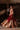 Model twirling in the Simran red bridal lehenga in a Lahore haveli, kalidaar panels flaring