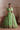 Zeba pistachio green Pakistani lehenga choli with organza dupatta draped on one shoulder and wide gota border hem