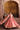 Avnoor salmon pink Pakistani lehenga twirl showing the full flare and flowing organza dupatta