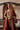 Three-quarter view of the Simran red bridal lehenga choli with the organza dupatta as a veil