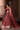 Back view of Bazaar light burgundy lehenga choli showing the open choli back and draped organza dupatta