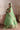 Zeba pistachio green Pakistani mehndi lehenga side pose with four-sided embellished organza dupatta