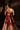 Open back of the Simran raw silk choli with hand-embellished back neckline and gold tassels