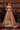 Gurleen rust brown mehndi lehenga, full-length view showing the sequinned gota border hem
