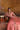 Avnoor salmon pink Pakistani bridal lehenga choli seated portrait with sequinned organza dupatta