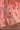 Avnoor salmon pink Pakistani lehenga hem detail in aari tilla, golden sequins and resham with hand-set mirrors