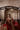 Simran red lehenga choli seated on a palang, a rich look for wedding guests and bhabhis
