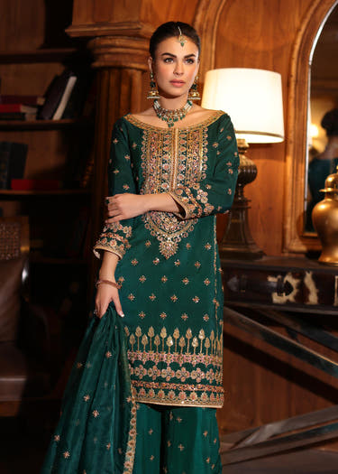 Emerald Green luxury pret dress with intricate gold embroidery by Waqas Shah