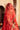 Aarohi orange mehndi lehenga with the organza dupatta over the head