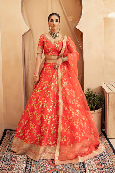 Aarohi orange Pakistani mehndi lehenga choli in Korean raw silk, full front view with organza dupatta