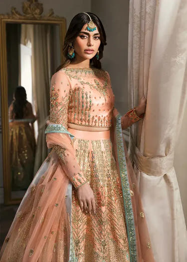 Artistry Rose Peach Pakistani Mehndi lehenga with hand embellishment by Waqas Shah Official