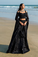 Black Musk black Pakistani formal lehenga choli, full front view with cold-shoulder embellished choli, sequin lehenga and net dupatta
