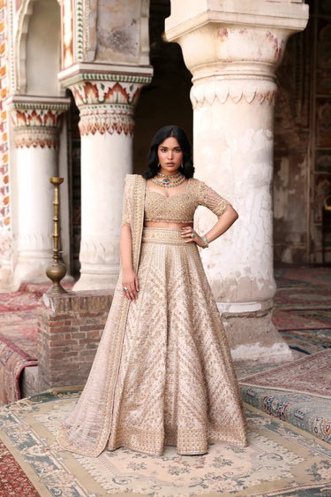 Champagne Gold Bridal Lehenga Choli by Waqas Shah featuring intricate hand embroidery and luxury bridal craftsmanship