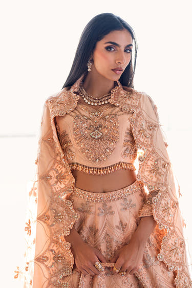 Waist-up view of the Coral Bliss choli with zardozi, sequin and pearl work and a beaded tassel hem
