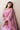 Crystal Blush blush pink formal lehenga choli seated, showing the square neckline choli with beaded tassel hem