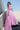 Full-length Crystal Blush blush pink Pakistani sequin lehenga choli on the staircase