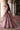 Back view of the Diyar blush pink bridal lehenga with the embellished net dupatta trailing behind by Waqas Shah Official