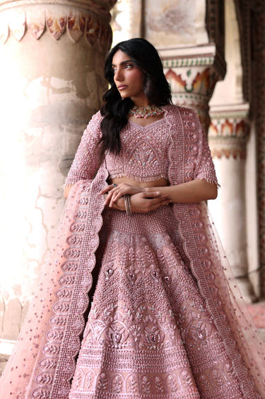 Diyar blush pink bridal lehenga choli with crystal pearl and sequin hand embellishment by Waqas Shah Official